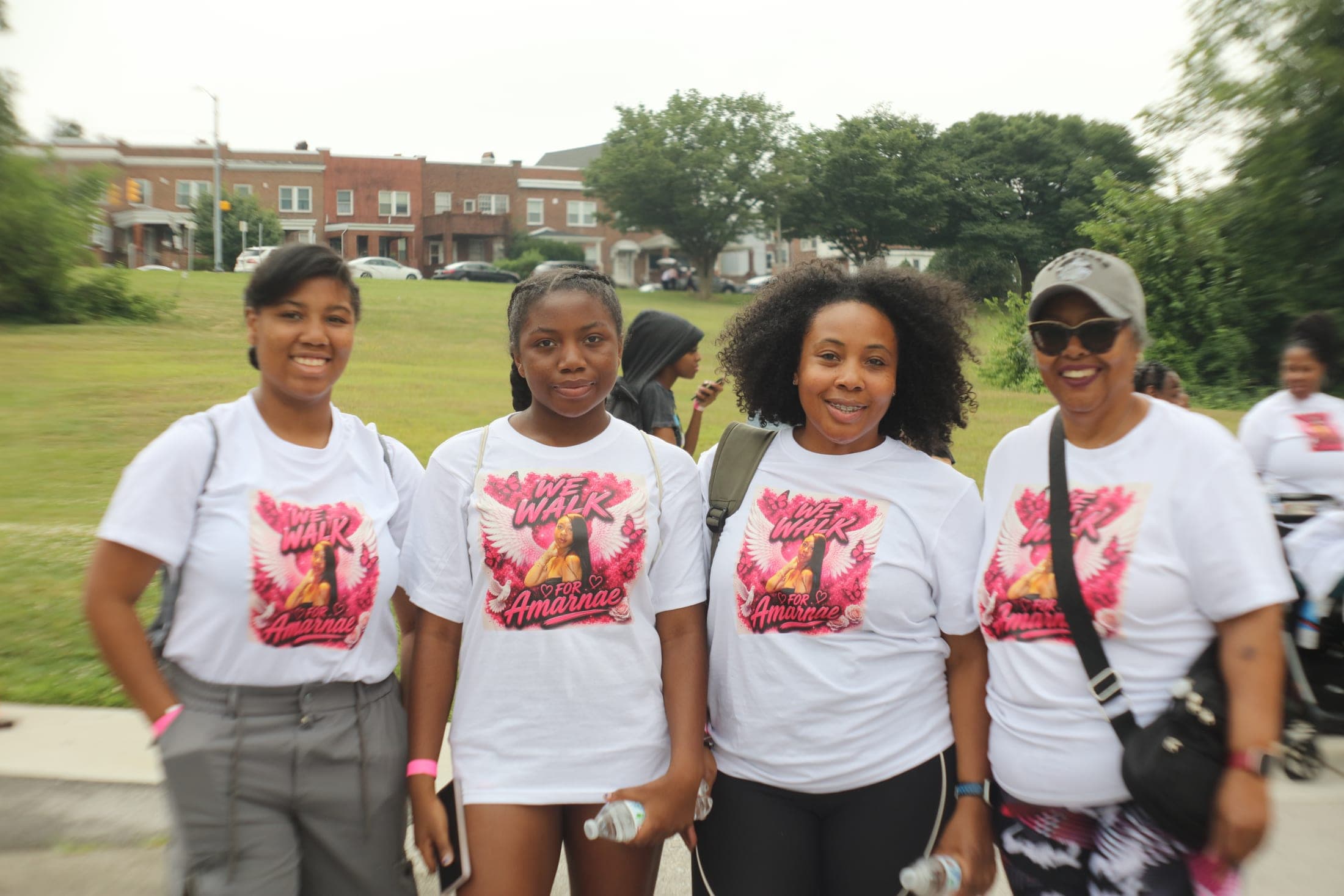 Families and friends gather in pink to honor their loved ones.